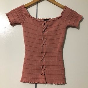 Over the shoulder front lace up top